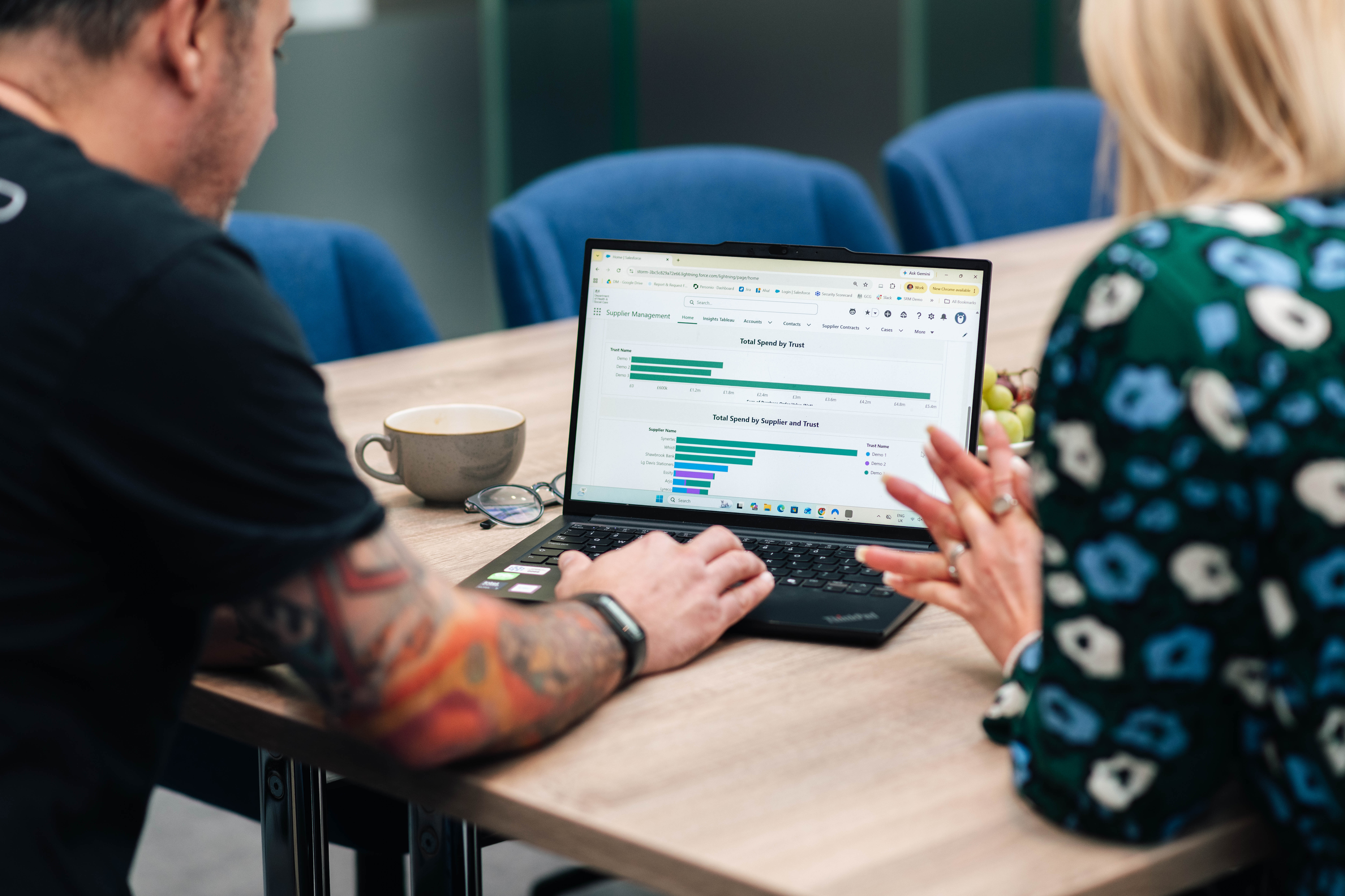 Two members of Digital Modus management working on a laptop